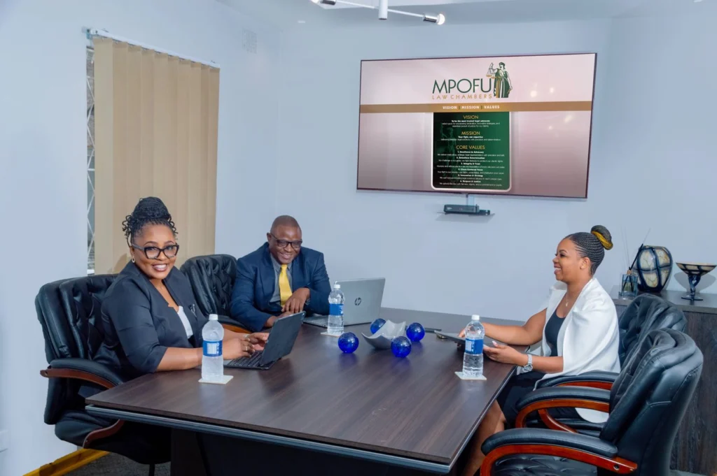 Boardroom with the firm’s vision, mission and values on screen