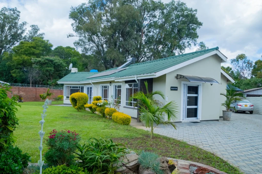 Well-kept lawns and paved driveway at the chambers